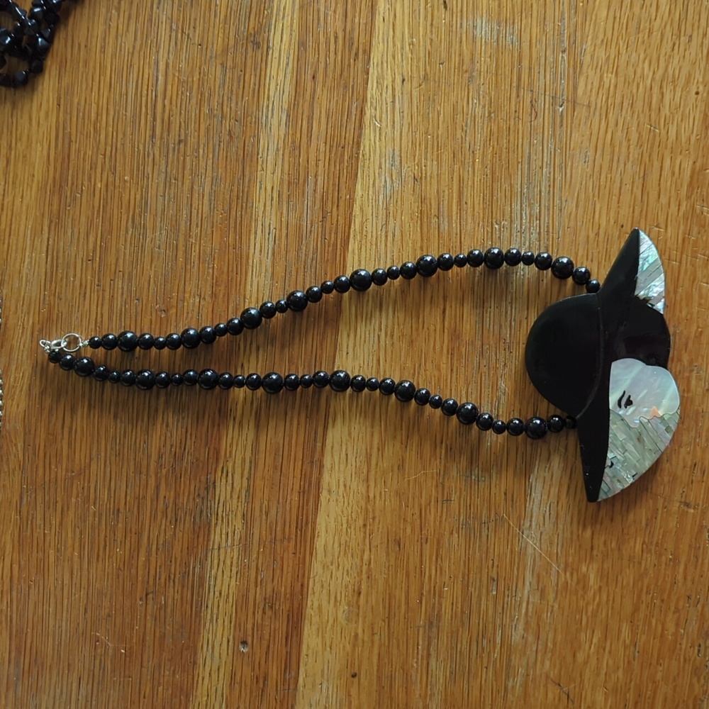 Lady with hat beaded necklace